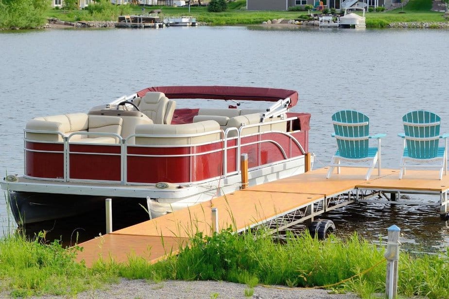 One of the easier-to-drive pontoon boats tied to the backyard dock