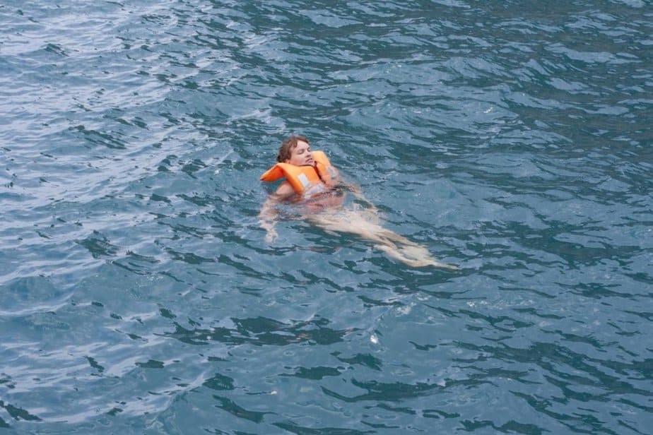 Woman wearing a life preserver to help prevent drowning when ending up in the water unintentionally